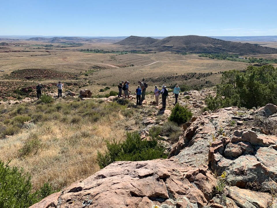 Picture of Douglas Meteor Crater with geologists standing on rim, Converse County, Wyoming
